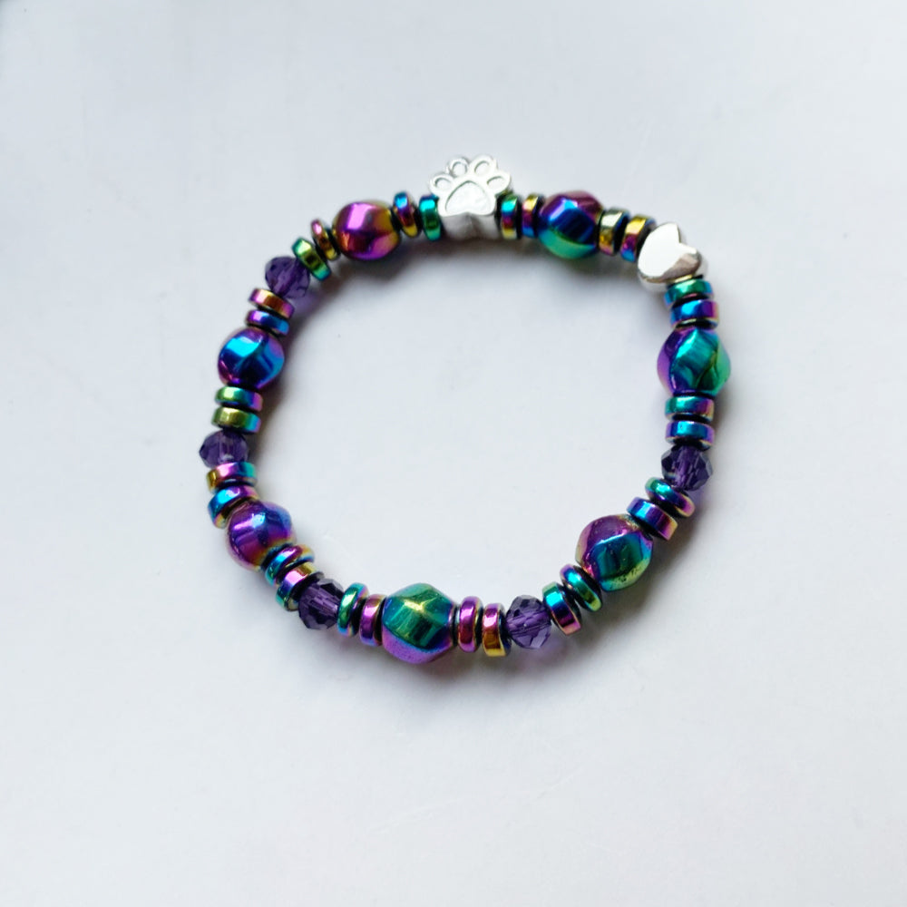 Magnetiskt armband med tassberlock