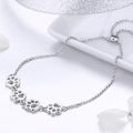 Justerbart armband i sterlingsilver med hundtassar