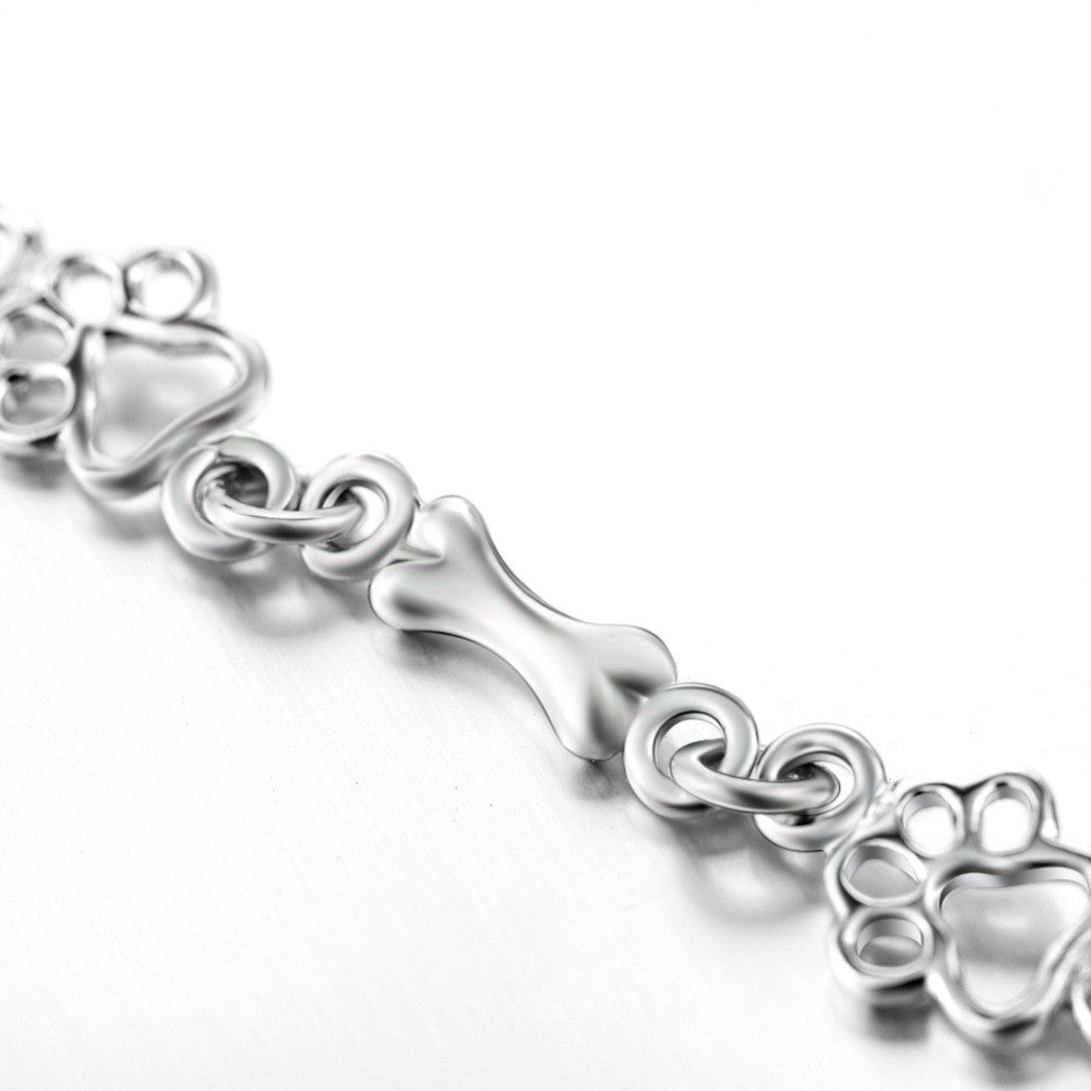 Silverarmband med tass- och benberlocker