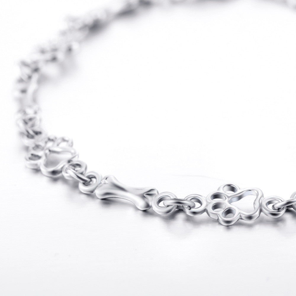 Silverarmband med tass- och benberlocker