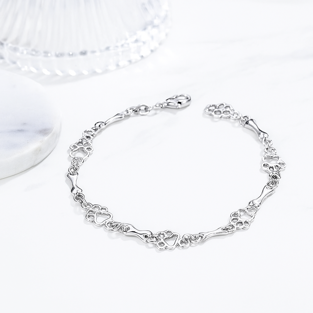 Silverarmband med tass- och benberlocker