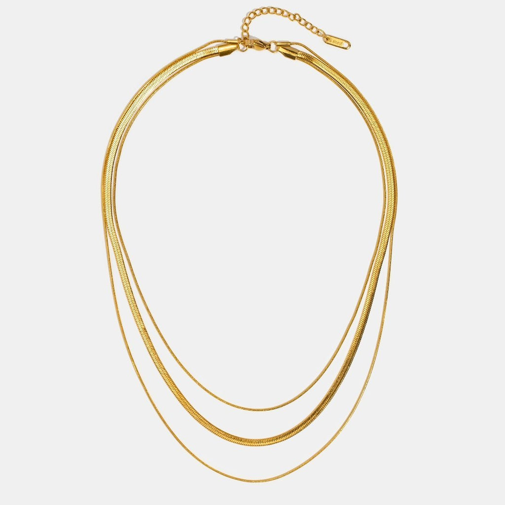 Guldfärgat halsband i flera lager