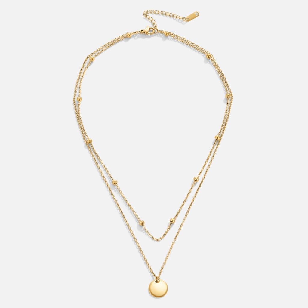 Halsband med skivformade hängen i flera lager